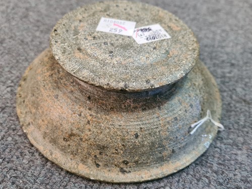 Lot 91 - A Chinese green puddingstone tripod small vase, perhaps Tang Dynasty