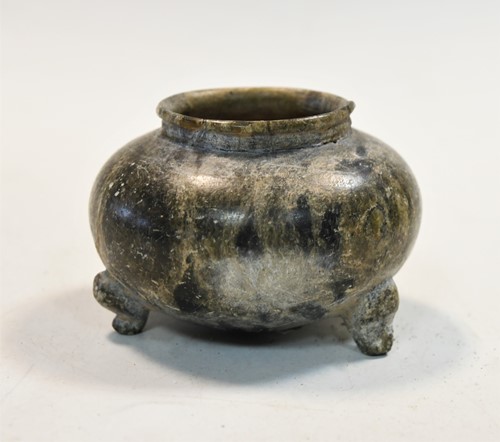 Lot 91 - A Chinese green puddingstone tripod small vase, perhaps Tang Dynasty