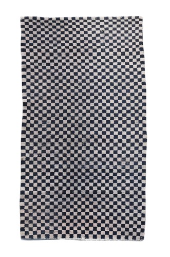 Lot 129 - A Tibetan chequerboard wool rug, circa 1950-60