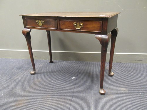 Lot 503 - A George III oak lowboy