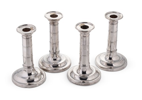 Lot 558 - A set of four George III 18th century silver candlesticks