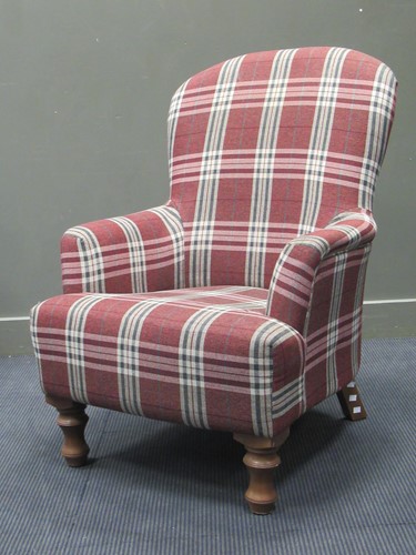 Lot 507 - A modern easy chair with red checked fabric...
