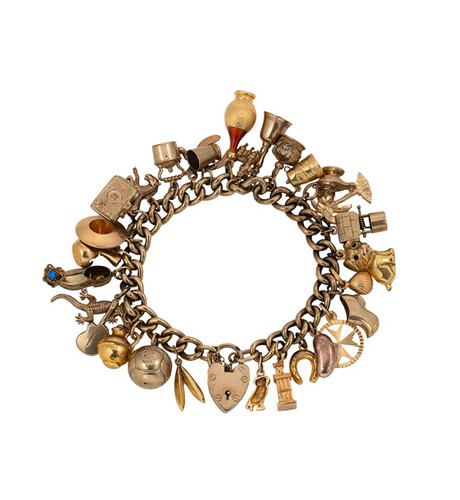 Lot 135 - A charm bracelet with assorted charms