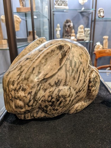 Lot 96 - A Chinese green pudding stone marble crouched hare, in Tang Dynasty style
