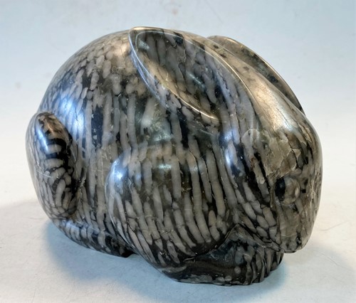 Lot 96 - A Chinese green pudding stone marble crouched hare, in Tang Dynasty style