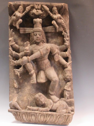 Lot 169 - A large Indian carved wood panel of a Goddess,...