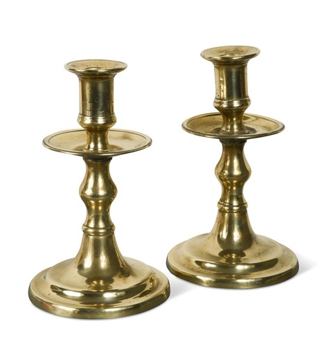 Lot 113 - A pair of brass candlesticks, 17th century