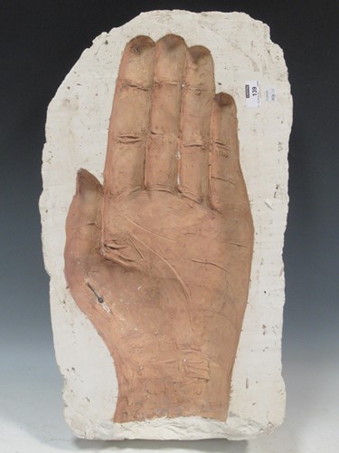 Lot 139 - A plaster model of an impresed large hand, 63...