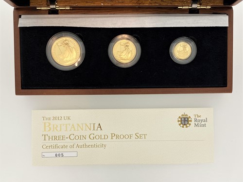 Lot 28 - The Royal Mint Britannia gold three-coin set...