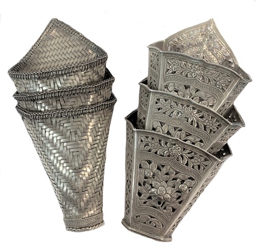 Lot 467 - Two sets of three Asian metalwares sirih (betel leaf) holders