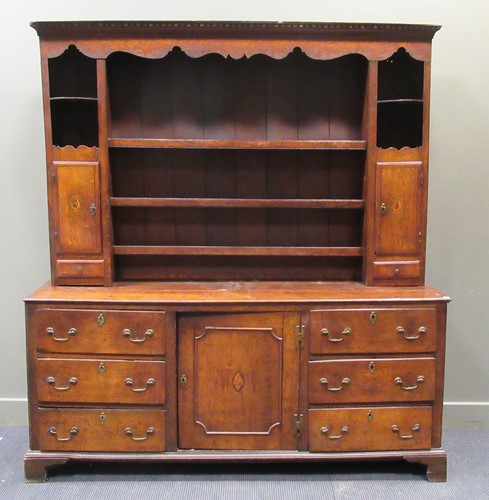 Lot 557 - A North Country oak and shell marquetry Welsh...