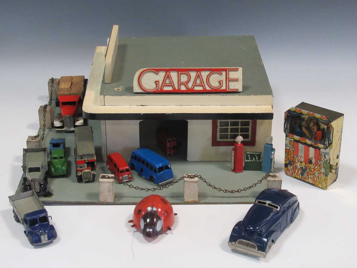 Lot 102 - A model toy garage, probably 1950s, with...