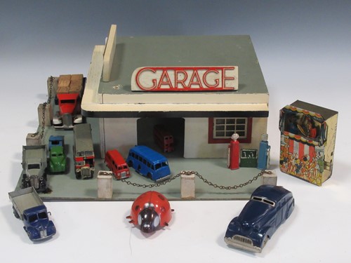 Lot 102 - A model toy garage, probably 1950s, with...