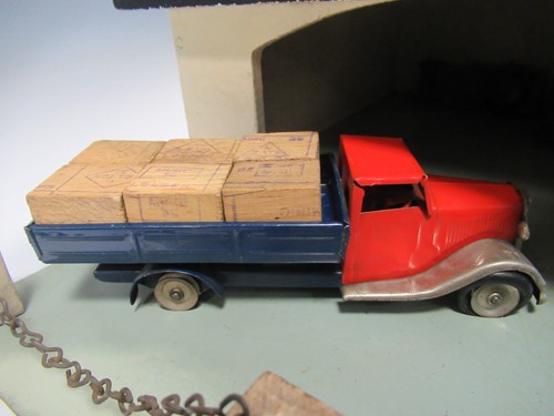 Lot 102 - A model toy garage, probably 1950s, with...