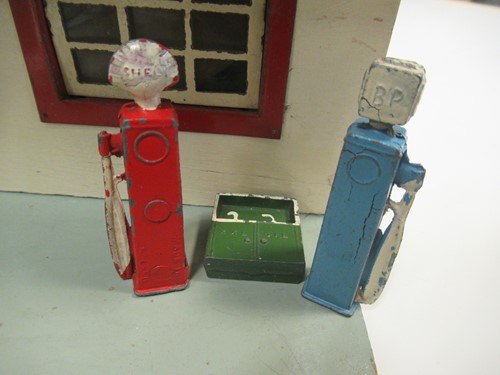 Lot 102 - A model toy garage, probably 1950s, with...