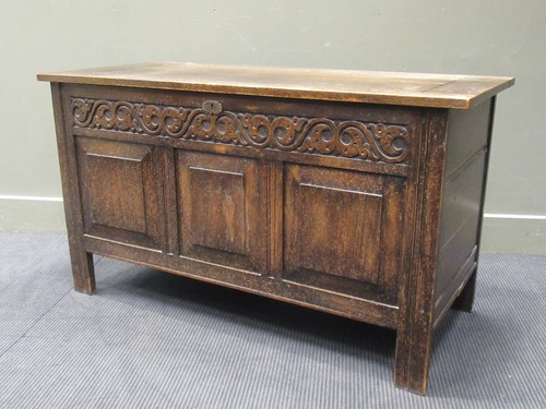 Lot 515 - An oak coffer, with carved frieze over three...