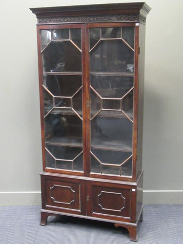 Lot 564 - A 19th century glazed mahogany bookcase on...