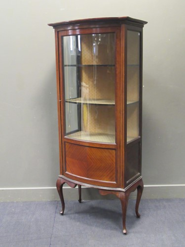 Lot 550 - An Edwardian inlaid walnut display cabinet on...