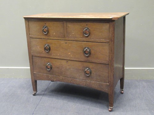 Lot 499 - An Arts and Crafts oak chest of two short and...