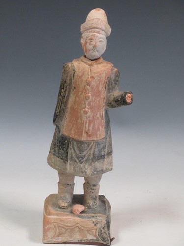 Lot 77 - A Tang style figure of an official, 33cm high