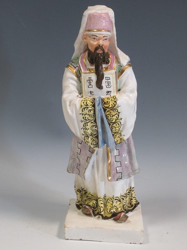 Lot 76 - A 19th century Italian pottery figure of an...