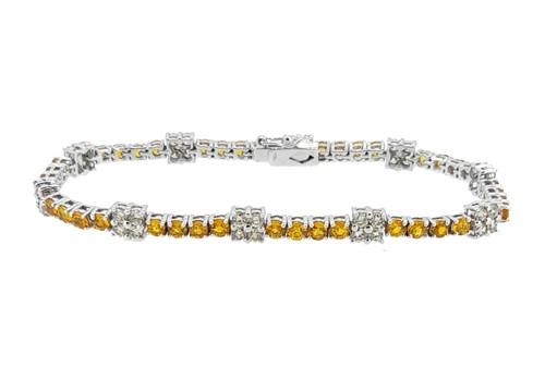 Lot 220 - A yellow sapphire and diamond fancy line bracelet
