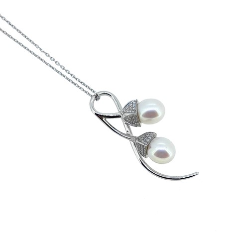 Lot 31 - A pearl and diamond pendant