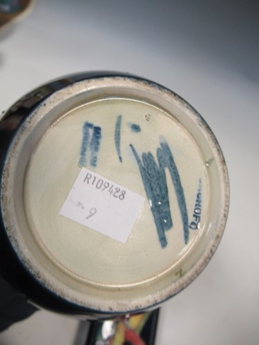 Lot 14 - A Moorcroft Orchid pattern ginger jar and...