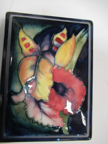 Lot 14 - A Moorcroft Orchid pattern ginger jar and...