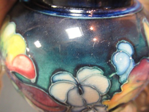 Lot 14 - A Moorcroft Orchid pattern ginger jar and...
