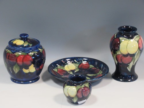 Lot 19 - Two Moorcroft Wisteria pattern vases, a jar...