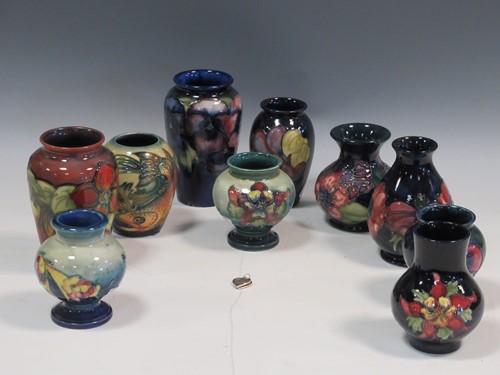 Lot 26 - A collection of ten small Moorcroft vases (10)