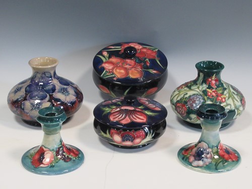 Lot 4 - Two Moorcroft powder boxes and covers, a pair...