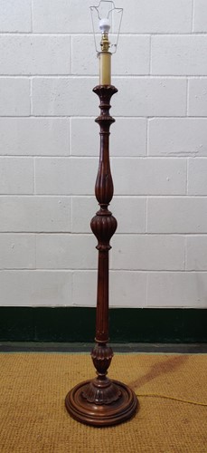 Lot 548 - A 20th century carved wood standard lamp, the...