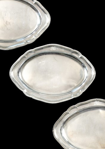 Lot 631 - An Edward VII silver meat platter together with two silver plated examples