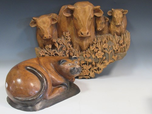 Lot 133 - A carved wood plaque of cattle signed with...