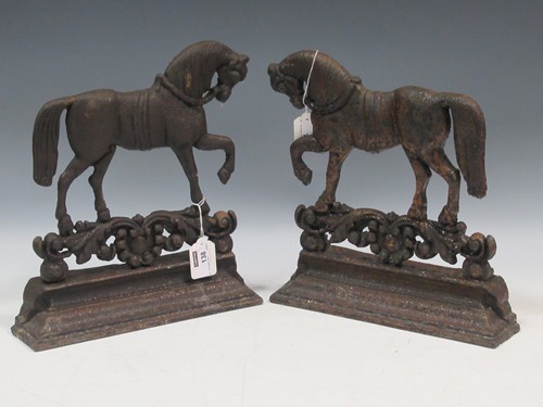 Lot 138 - A pair of cast iron door stops modelled as...
