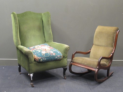 Lot 492 - An Edwardian wingback armchair with green...
