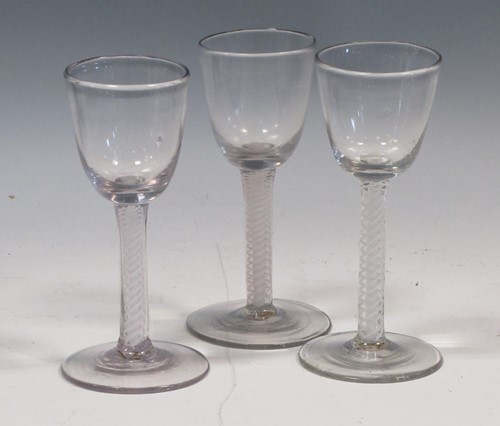 Lot 79 - Three late 18th century opaque twist stem glasses
