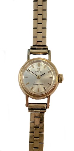 Lot 398 - Omega - A 9ct gold 'Ladymatic' wristwatch with a later 9ct gold bracelet