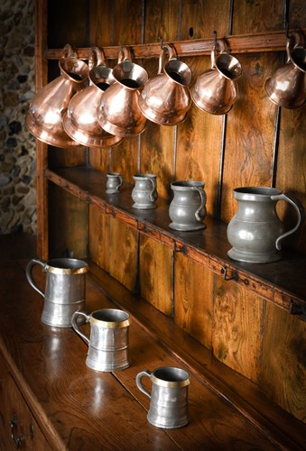 Lot 139 - A graduated set of six copper measures, 19th century
