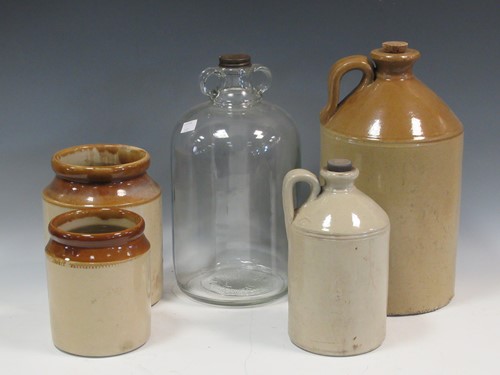Lot 58 - Two ceramic flagons, one marked 'Whiteways' on...