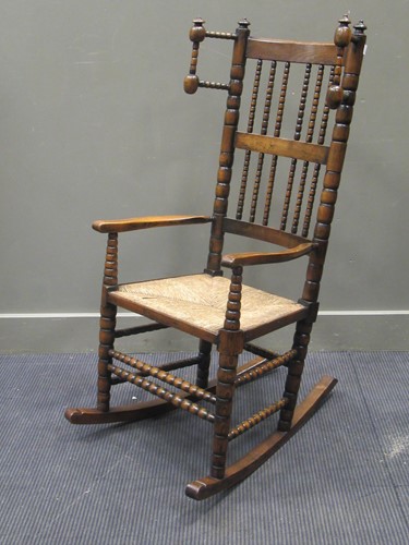 Lot 520 - An Elm Lancashire rocking chair with rushed...
