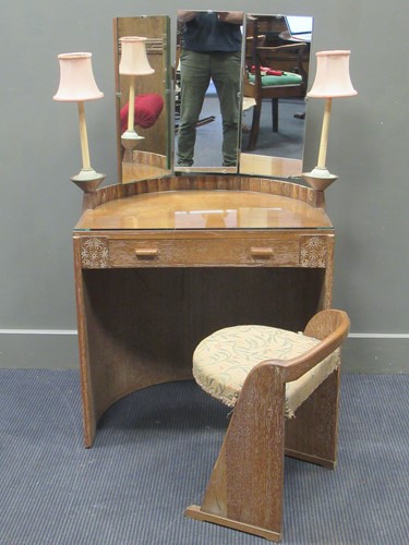 Lot 485 - A limed oak barrell back dressing table, the...