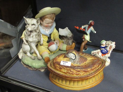 Lot 61 - A bisque porcleain model of a young boy with a...