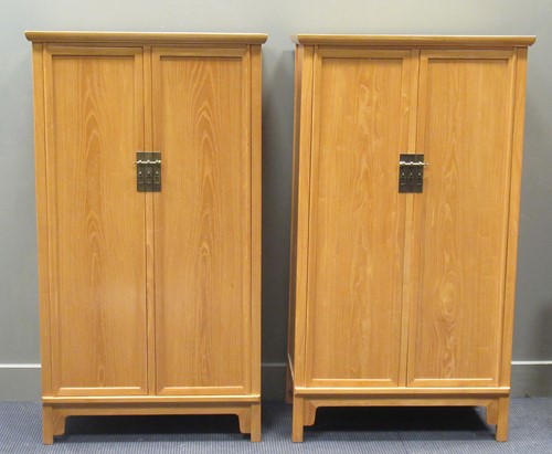 Lot 454 - A pair of modern Chinese elm cabinets, each...