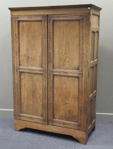 Lot 563 - An oak wardrobe with panelled doors, 182 x 119...