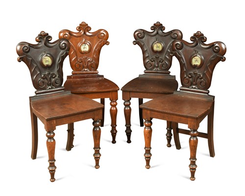 Lot 343 - A set of four mahogany crested hall chairs, early 19th century