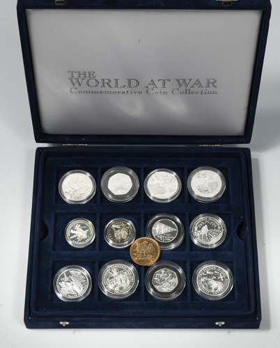 Lot 17 - The World at War, 12 proof type coins and...