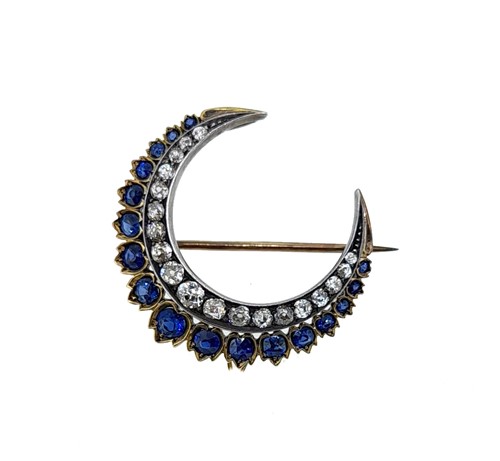 Lot 189 - A sapphire and diamond crescent brooch